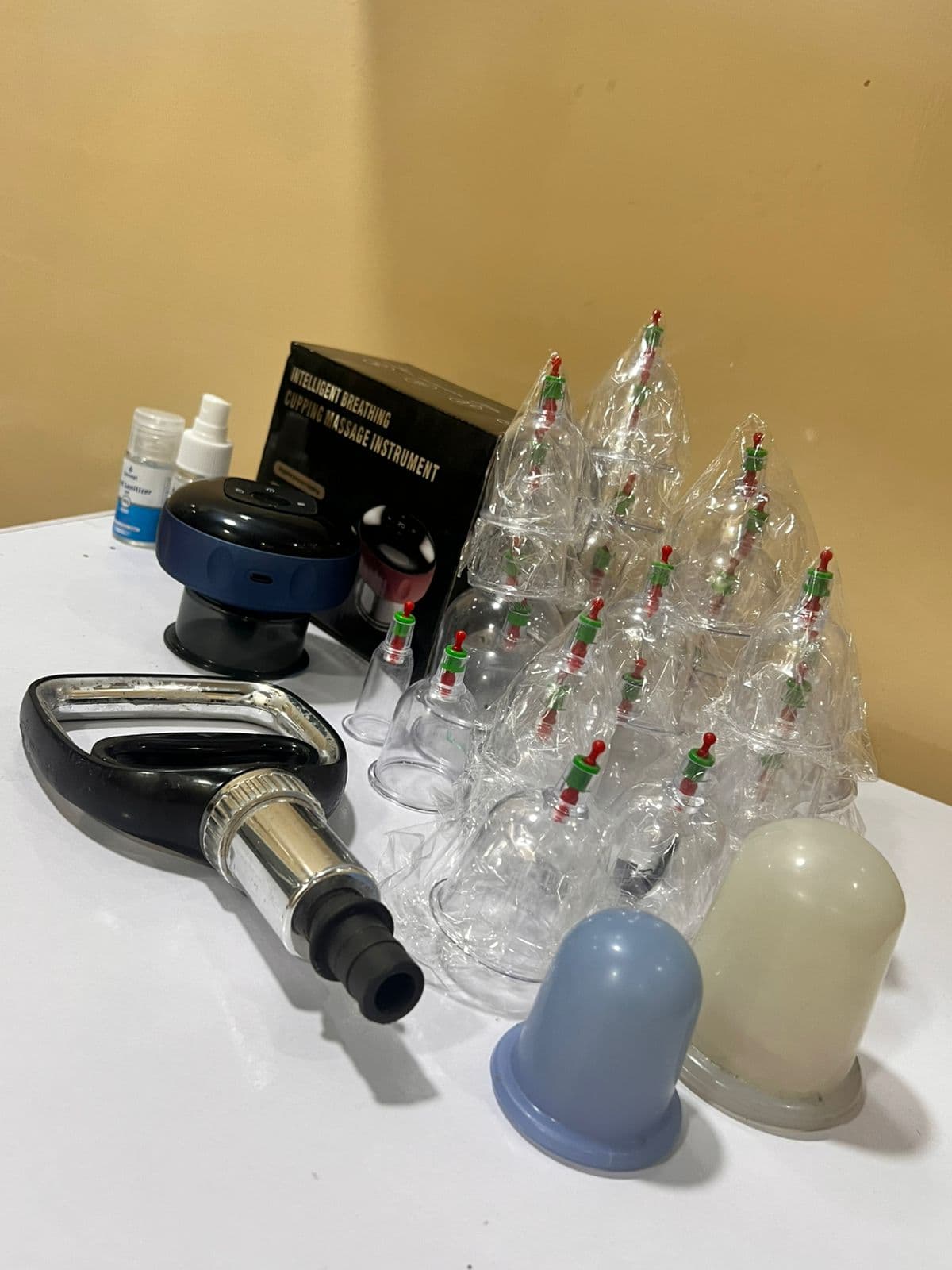 Dry and wet cupping cups, silicone sets, and suction tools ready in the treatment room